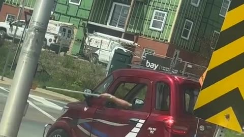 Tiny Car Crosses The Street