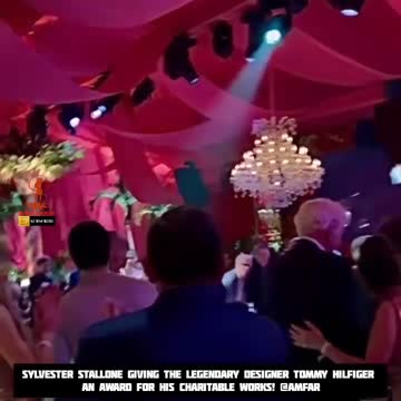 Sylvester Stallone Giving the legendary Designer Tommy Hilfiger an Award For His Charitable Works