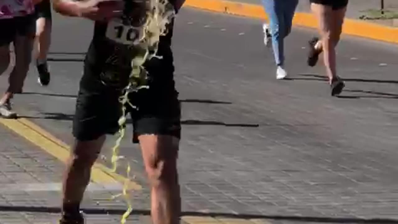 Runner Gets Superhero Escort to Finish Line