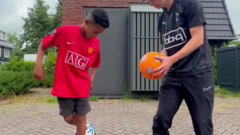 Mini ronaldo learns foot ball skils!!