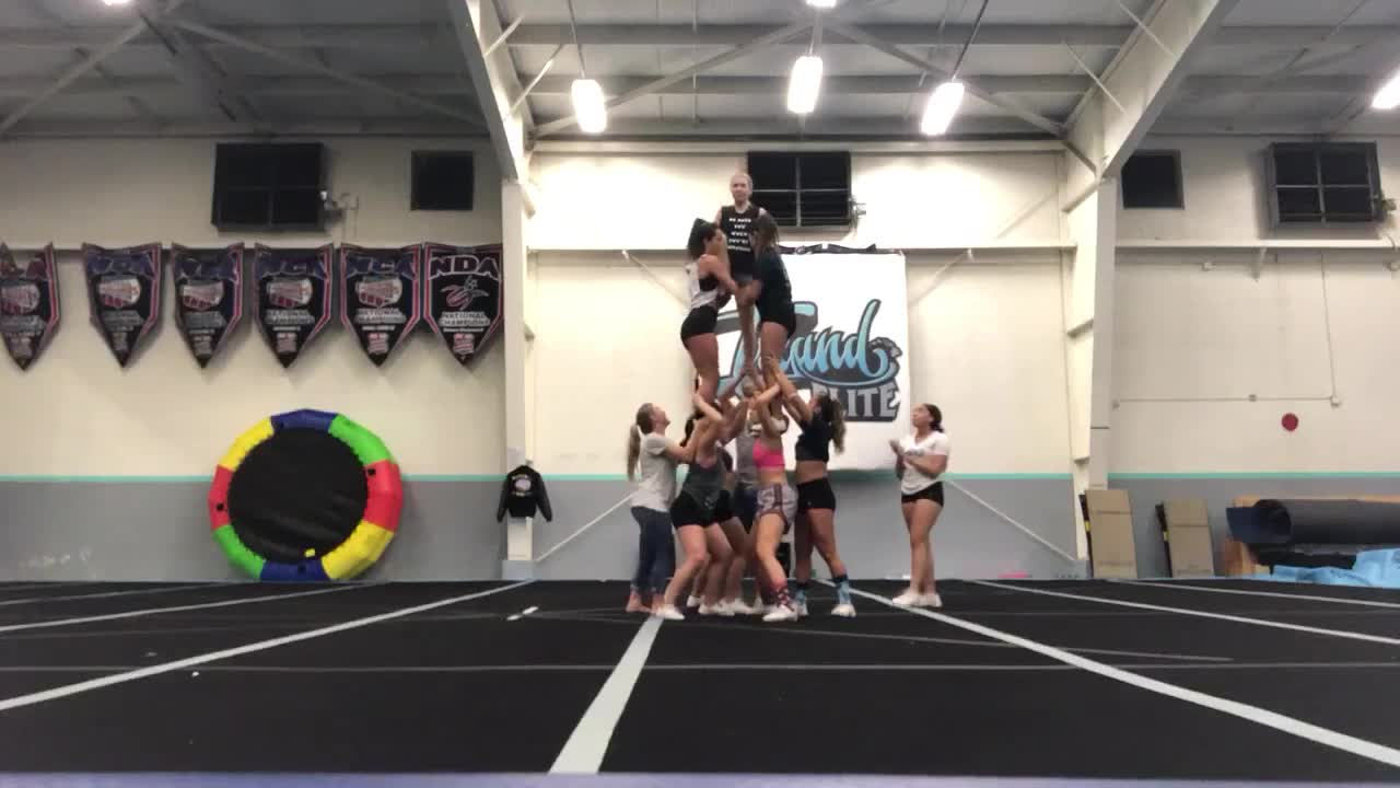 Cheer practice pyramid girl on top falls