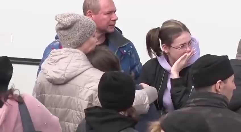 Russian men saying goodbye to their families and mobilizing