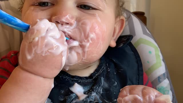 Happy Baby Makes a Mess Eating Yogurt