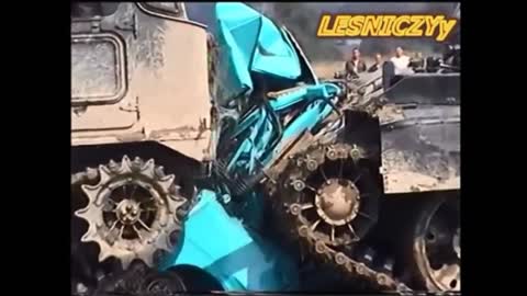 Tanks demolishing cars