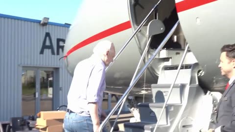 Julian Assange boarding a plane after his release from prison