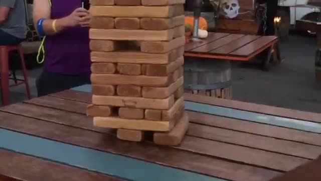 Guy pull out giant jenga block