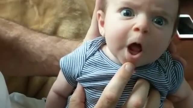 Adorable talking baby wants mommy to listen to her.