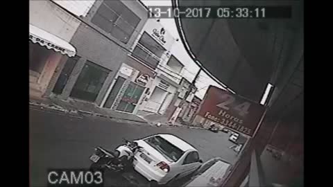 Distracted Biker Smashes into Car