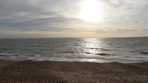 Sun is setting. On beach.