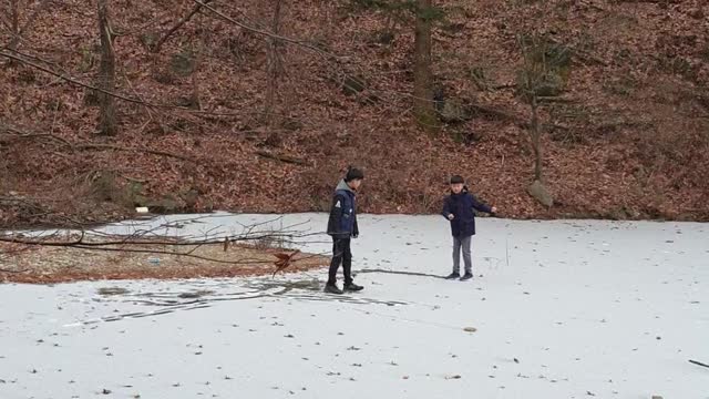 Dancing kids on the frozen reservoir