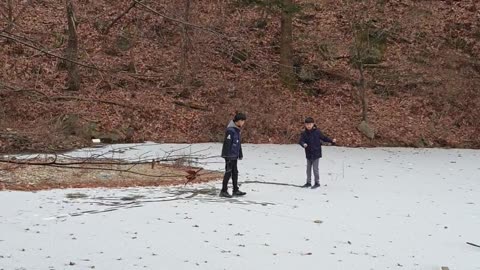 Dancing kids on the frozen reservoir