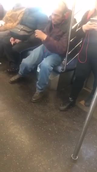 Man talks about life and marriage loudly on the phone on subway train