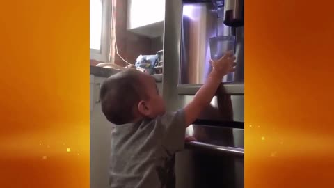 Kid tries to get his own drink