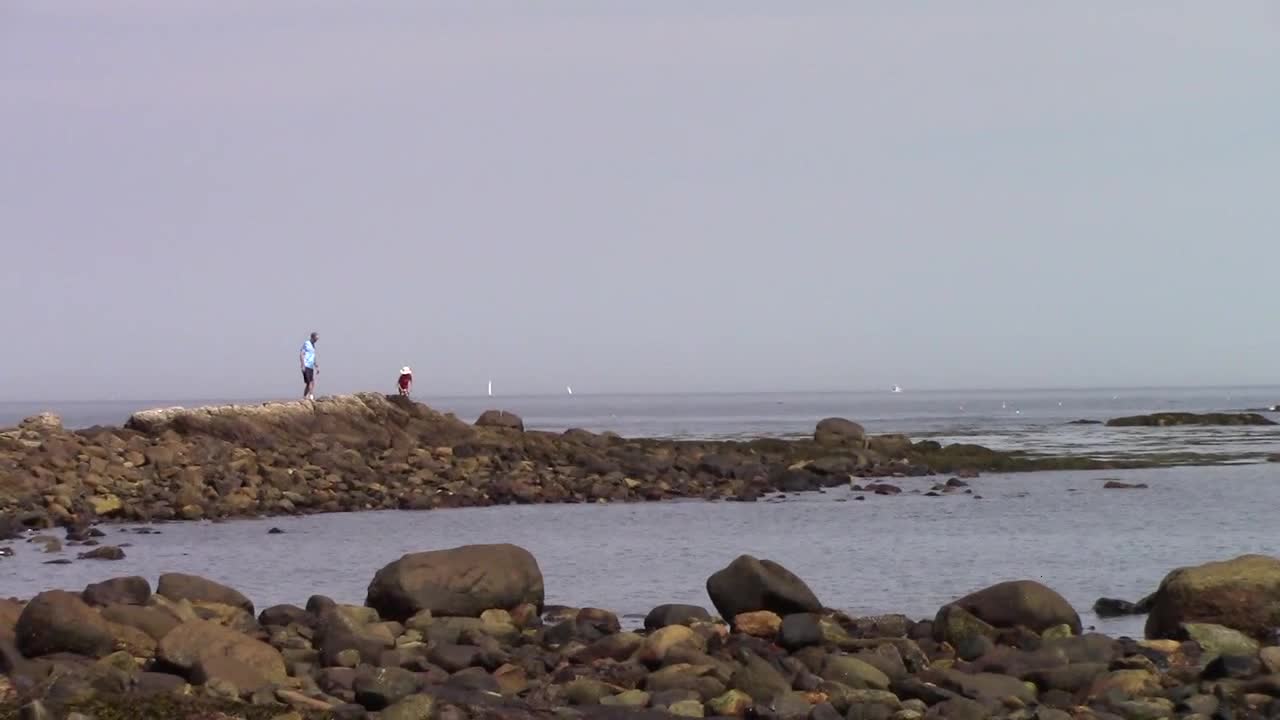 Climbing on Rocks at Seaside