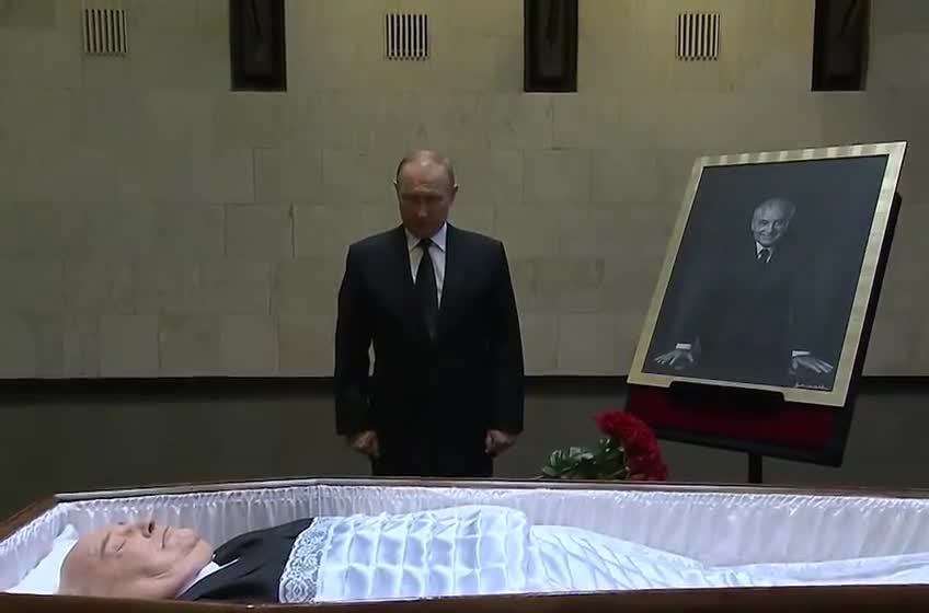 Putin takes one last look at Gorbachev's coffin