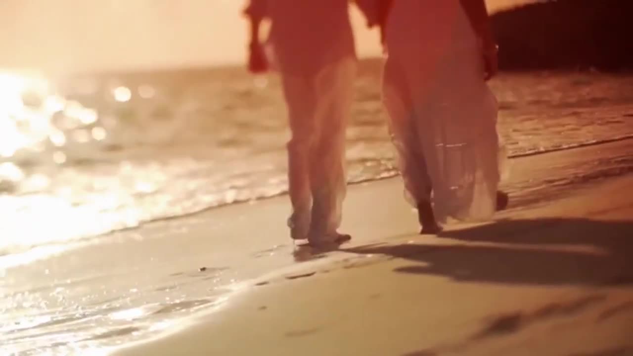 Beautiful Couple walking on the Beach at Sunset | Free Stock Videos Footage