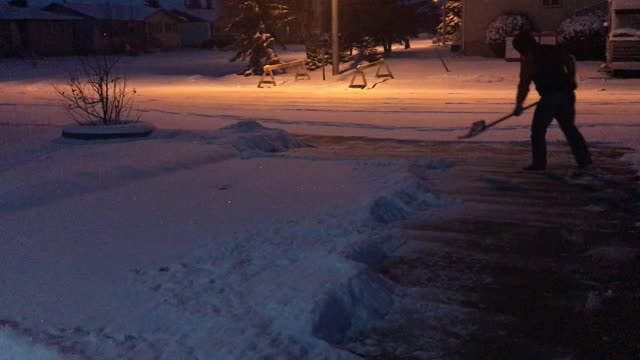 Shoveling before sunrise