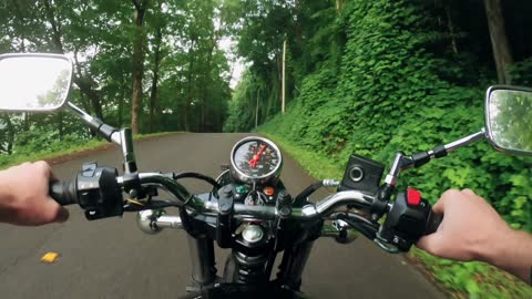 Motor cycle riding in the forest road