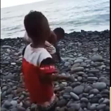 stone throwing child