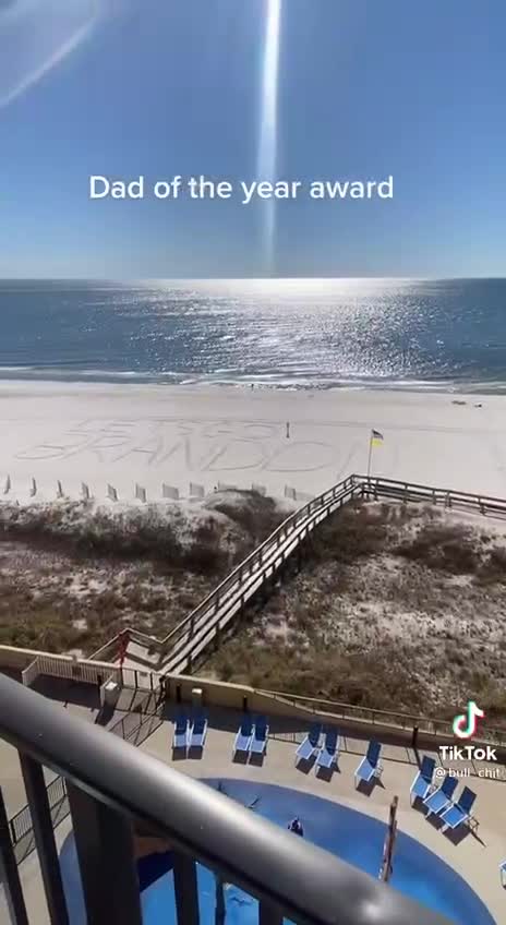 Writing in the sand "Let's Go Brandon"