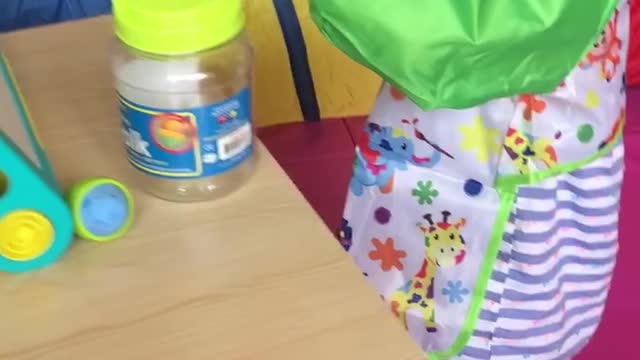Using her table for chalk art