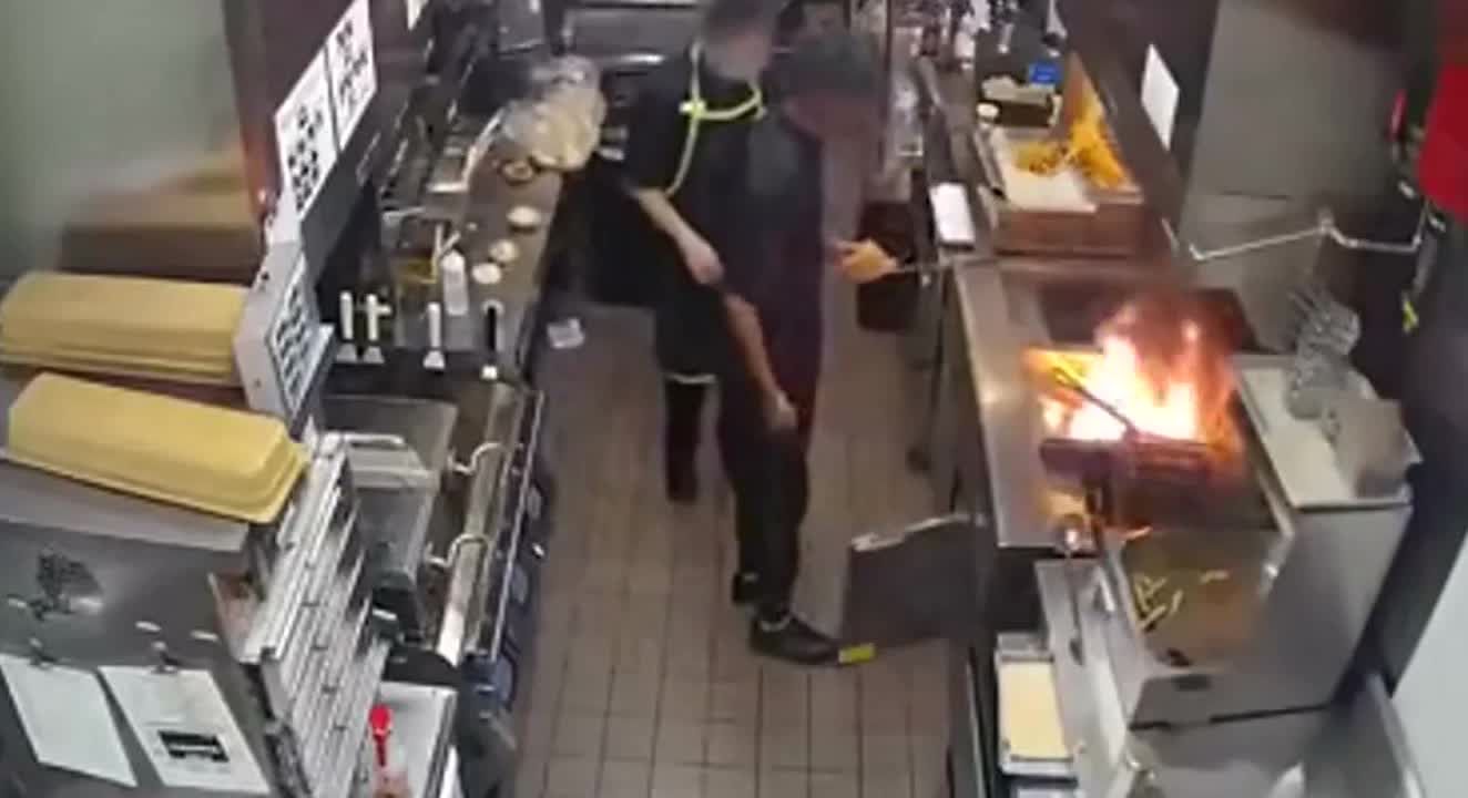Is it a good idea to throw water on a grease fire?