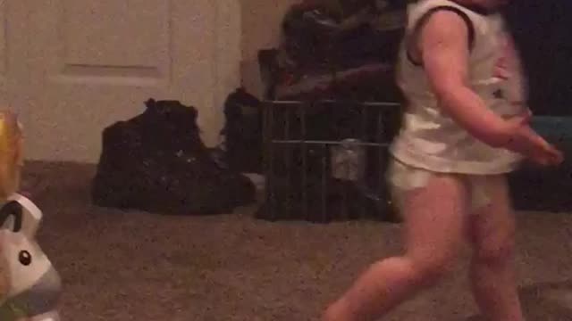 Little boy diaper runs in circles runs into barrier