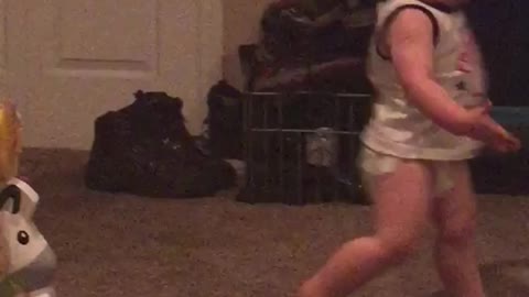 Little boy diaper runs in circles runs into barrier