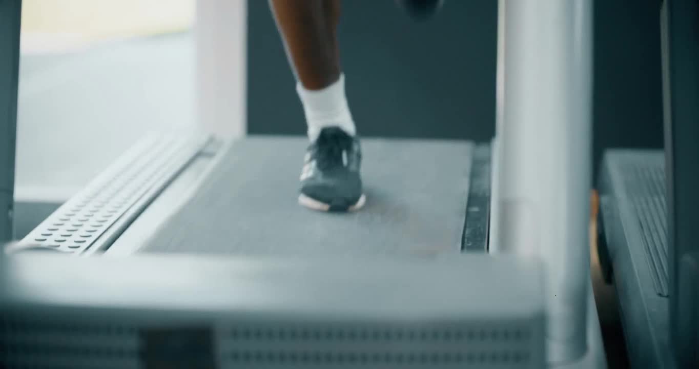 Mans Legs Whilst Running on Treadmill