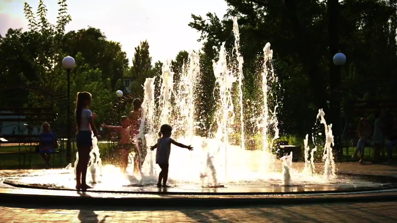 Kids Having Fun Playing in the Water at Park