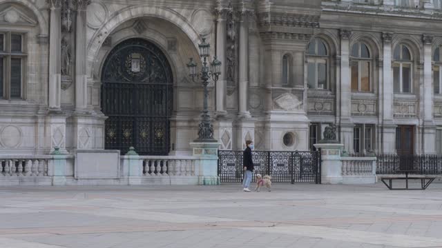 Woman with a dog near Hôtel de Ville