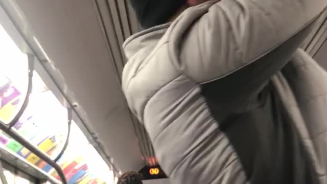 Guy does pull ups on subway train