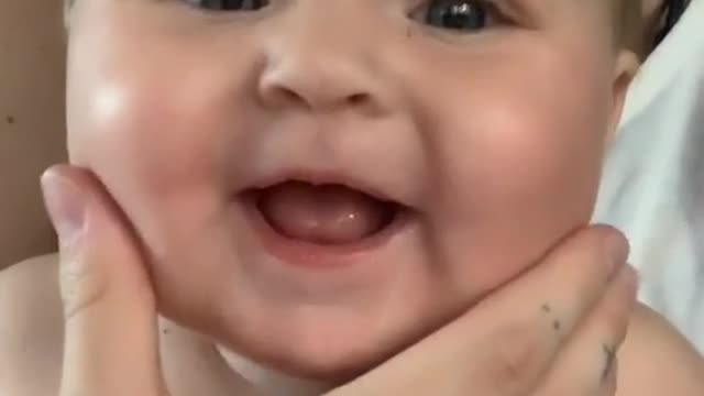 A handsome kid playing with his mam