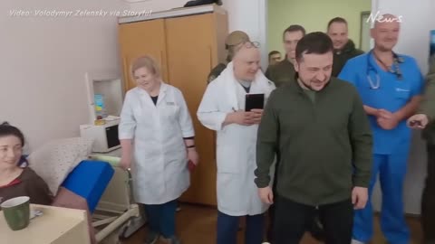 Zelensky visits family wounded by Russian shelling