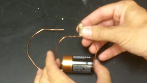 Here's how to get this light bulb to glow with a battery.