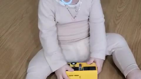 The baby is playing with toys