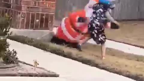 The little girl beats Santa hard