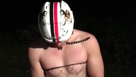 Guy in underwear and white helmet hits head opens beer