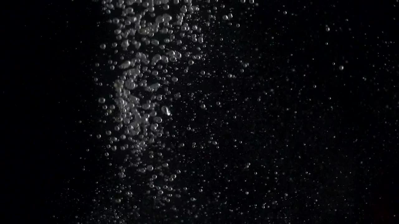 Bubbles rising in water