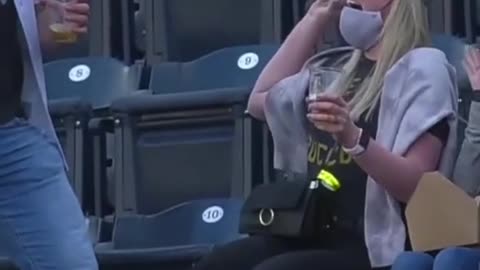 She snagged it with one hand while holding a drink