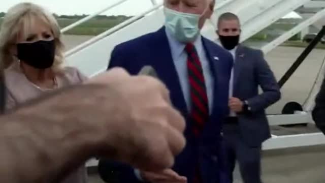 Dr. Jill Caught Physically Backing Joe Biden Away from Reporters at Airport After He Gets Stuck with His Hand Out