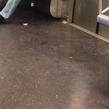 Man grey sweater microphone face