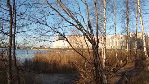 Panorama of the new district from the river Bank in late autumn