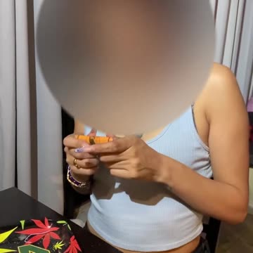 My ass-istant rolling a joint for us