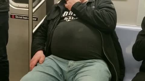 Guy sleeping eats his own boogers on a subway train