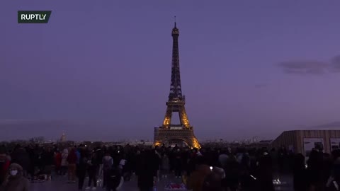 Eiffel Tower lit up in blue and yellow in solidarity with Ukraine