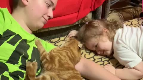 Very patient cat and a kid