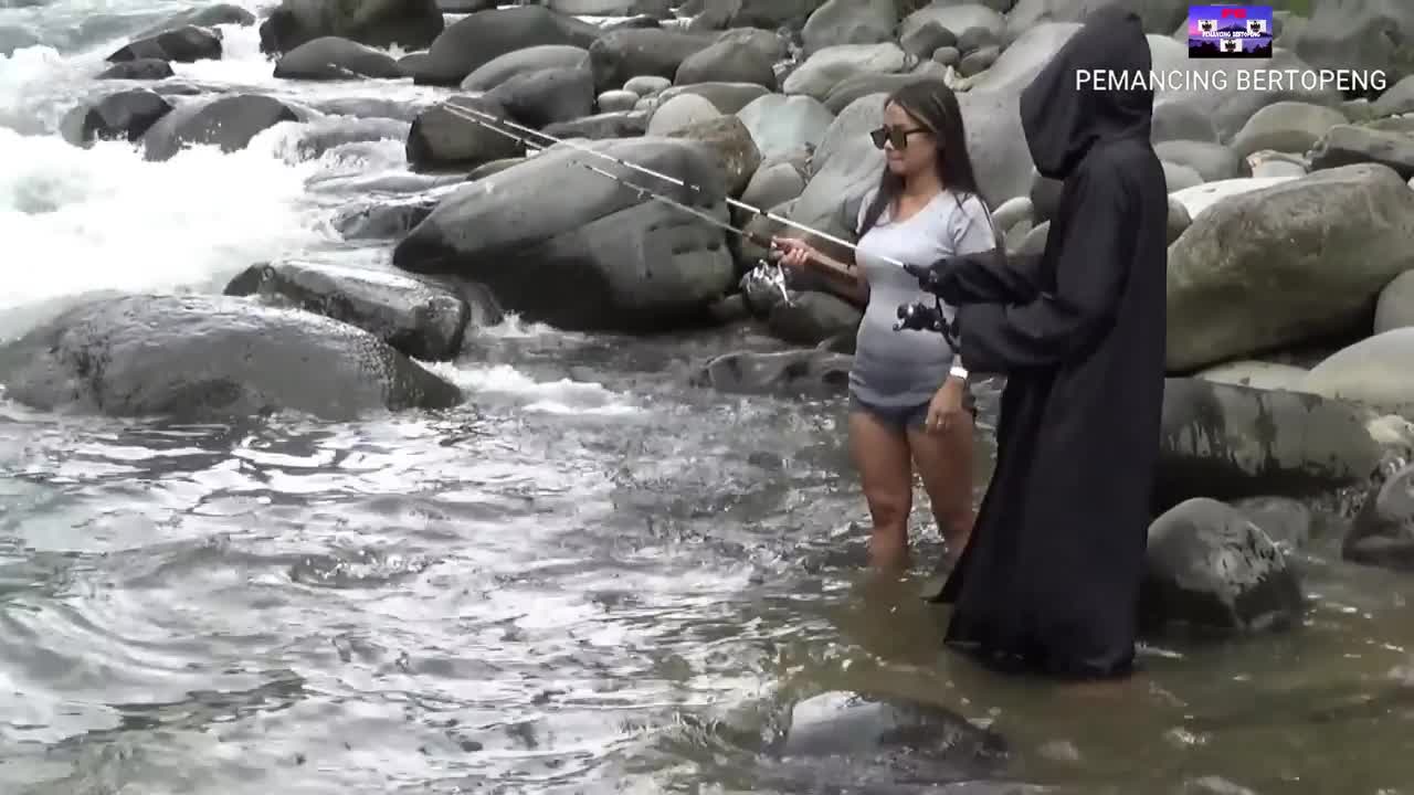 woman fishing for catfish in a fast current