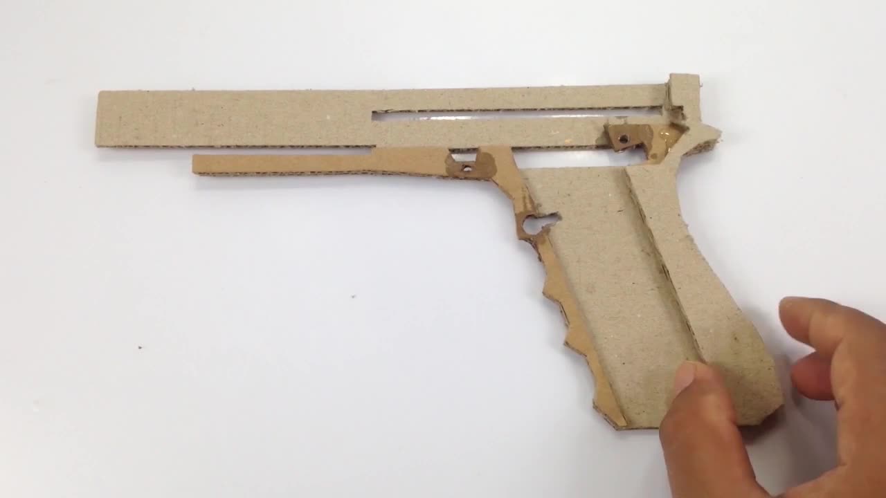 A cardboard pistol