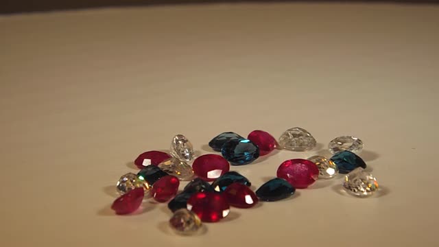 Gemstones, Red Rubies, White Zircons And London Blue Topaz Out Of The Jar...